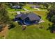 Aerial view of a single-Gathering home with large backyard and patio at 3927 Oak Pointe Dr, Lady Lake, FL 32159