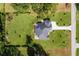 House with a large backyard and long driveway at 3927 Oak Pointe Dr, Lady Lake, FL 32159