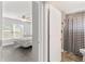 Bathroom with a shower/tub combo and black and white checkered floor at 3927 Oak Pointe Dr, Lady Lake, FL 32159
