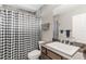 Clean bathroom with a checkered shower curtain and modern vanity at 3927 Oak Pointe Dr, Lady Lake, FL 32159