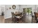Dining area with wooden table and chairs near sliding doors at 3927 Oak Pointe Dr, Lady Lake, FL 32159