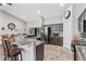 Modern kitchen with dark wood cabinets and granite countertops at 3927 Oak Pointe Dr, Lady Lake, FL 32159