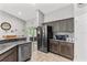 Modern kitchen with stainless steel appliances and granite countertops at 3927 Oak Pointe Dr, Lady Lake, FL 32159
