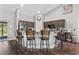 Kitchen island with four stools and stainless steel appliances at 3927 Oak Pointe Dr, Lady Lake, FL 32159