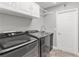 Laundry room with Samsung washer and dryer, and upper cabinets at 3927 Oak Pointe Dr, Lady Lake, FL 32159