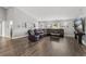 Spacious living area with dark brown leather furniture at 3927 Oak Pointe Dr, Lady Lake, FL 32159