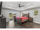 Bright bedroom with wood flooring and access to backyard patio at 3927 Oak Pointe Dr, Lady Lake, FL 32159