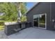 Outdoor kitchen with grill, sink, and patio seating at 3927 Oak Pointe Dr, Lady Lake, FL 32159