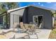 Large patio with lounge chairs and a view of the backyard at 3927 Oak Pointe Dr, Lady Lake, FL 32159