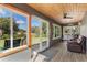 Relaxing screened porch with patio furniture and backyard view at 3927 Oak Pointe Dr, Lady Lake, FL 32159