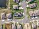 Aerial view showcasing a home's location within a residential neighborhood at 405 Amola Way, Howey In The Hills, FL 34737