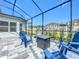 Enjoy this patio with fire pit and seating area at 405 Amola Way, Howey In The Hills, FL 34737