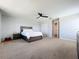 Main bedroom with a large bed, dresser, and walk-in closet at 405 Amola Way, Howey In The Hills, FL 34737