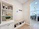 Inviting entryway with built-in bench seating and storage at 405 Amola Way, Howey In The Hills, FL 34737