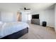 Spacious bedroom with large bed and dresser at 405 Amola Way, Howey In The Hills, FL 34737