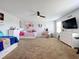 ' bedroom with twin bed, dresser, and gaming setup at 405 Amola Way, Howey In The Hills, FL 34737