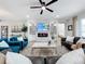 Open living space showcasing a cozy fireplace and main bedroom view at 405 Amola Way, Howey In The Hills, FL 34737