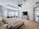 Spacious Primary bedroom with bay window and ceiling fan at 405 Amola Way, Howey In The Hills, FL 34737