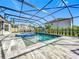 Refreshing pool and spa surrounded by a large screened patio at 405 Amola Way, Howey In The Hills, FL 34737