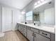 Double vanity bathroom with modern finishes and ample counter space at 405 Amola Way, Howey In The Hills, FL 34737