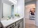 Modern bathroom with a vanity and a view into another room at 405 Amola Way, Howey In The Hills, FL 34737
