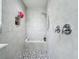 Large walk-in shower with tiled walls and a built-in seat at 405 Amola Way, Howey In The Hills, FL 34737