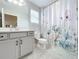 Bathroom with shower/tub combo and vanity at 405 Amola Way, Howey In The Hills, FL 34737