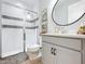 Clean bathroom with a walk-in shower, vanity, and modern fixtures at 405 Amola Way, Howey In The Hills, FL 34737
