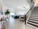 Elegant staircase leading to the upper level of the home at 405 Amola Way, Howey In The Hills, FL 34737