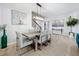 Bright dining area with a wood table, stylish chairs and modern chandelier at 405 Amola Way, Howey In The Hills, FL 34737