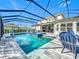 Inviting pool with covered patio and lounge chairs at 405 Amola Way, Howey In The Hills, FL 34737