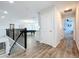 Upstairs hallway with access to bedrooms and bonus room at 405 Amola Way, Howey In The Hills, FL 34737