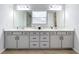 Double vanity bathroom with modern finishes and lots of storage at 405 Amola Way, Howey In The Hills, FL 34737