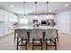 Modern kitchen with large island and stainless steel appliances at 405 Amola Way, Howey In The Hills, FL 34737