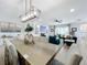 Spacious dining room with a long table, and open to the Gathering room at 405 Amola Way, Howey In The Hills, FL 34737