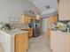 Open kitchen with island and stainless steel appliances at 4803 Sawgrass Lake Cir, Leesburg, FL 34748