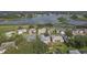 Aerial view of lakefront homes in a residential community at 4803 Sawgrass Lake Cir, Leesburg, FL 34748