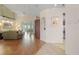 Living room with hardwood floors, and access to a sunroom at 4803 Sawgrass Lake Cir, Leesburg, FL 34748