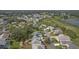Aerial view of house and golf course community at 4803 Sawgrass Lake Cir, Leesburg, FL 34748
