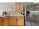 Corner kitchen sink and stainless steel refrigerator at 4803 Sawgrass Lake Cir, Leesburg, FL 34748