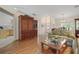 Living room with hardwood floors, and view of kitchen at 4803 Sawgrass Lake Cir, Leesburg, FL 34748