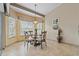 Breakfast nook with bay window and glass-top table at 4803 Sawgrass Lake Cir, Leesburg, FL 34748