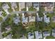 Bird's eye view of neighborhood with homes and lush green spaces at 4803 Sawgrass Lake Cir, Leesburg, FL 34748