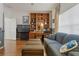 Gathering room featuring hardwood floors, a built-in entertainment center, and comfortable seating at 4803 Sawgrass Lake Cir, Leesburg, FL 34748