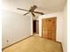 Spacious bedroom with ceiling fan and large closet at 501 Cherry Tree St, Eustis, FL 32726