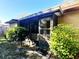 Screened patio with lush green landscaping at 501 Cherry Tree St, Eustis, FL 32726