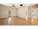 Spacious living room with hardwood floors and access to other rooms at 9442 Cr 674, Bushnell, FL 33513