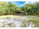 Open-air barn with a chain link fence at 9442 Cr 674, Bushnell, FL 33513