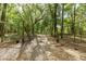 Long driveway leading to a house in a wooded area at 9442 Cr 674, Bushnell, FL 33513