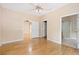 Bright bedroom with wood floors and access to bathroom at 9442 Cr 674, Bushnell, FL 33513